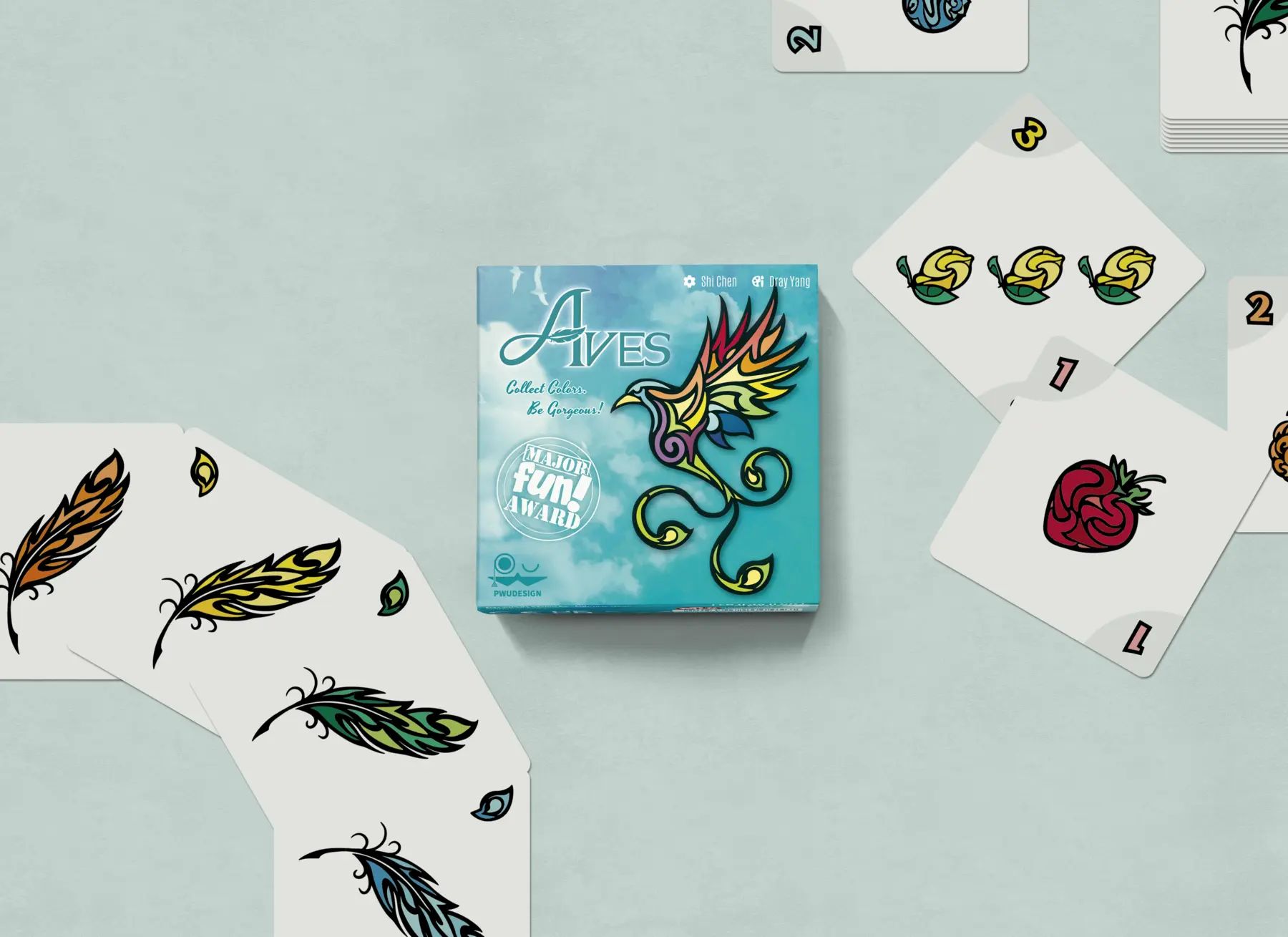 Aves box, fruit cards, feather cards, and crow cards arranged together