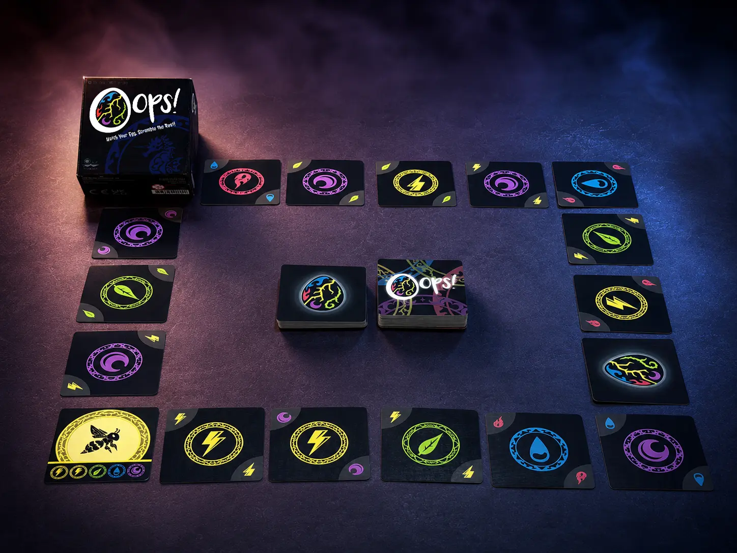 0ops! box, element cards, Arcane Egg cards, and a complete table setup